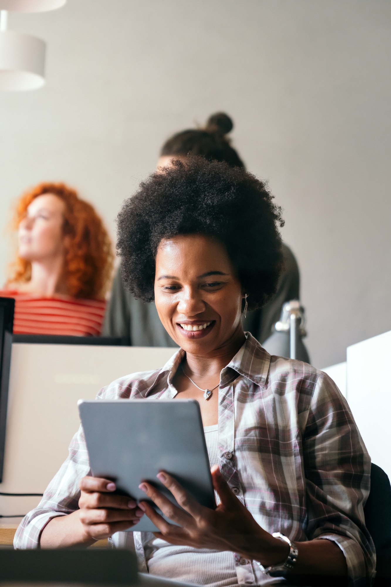 African american woman with tablet, innovation in research and programming for future app technology